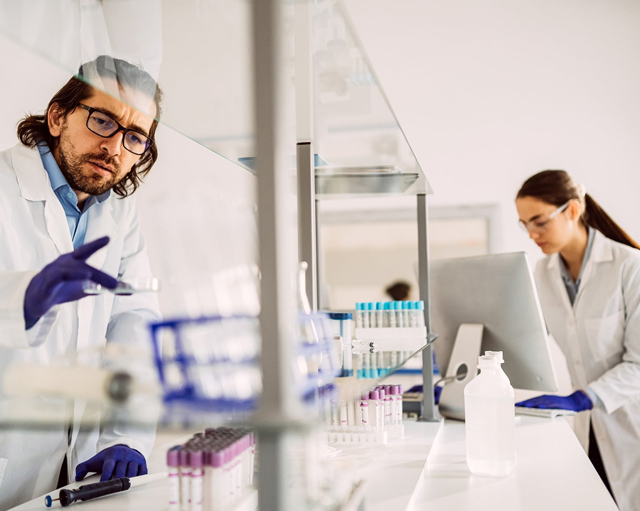 Scientists reviewing simplified IVDR documentation in lab